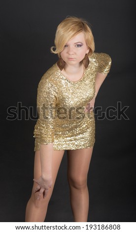 portrait of sensual girl in gold dress
