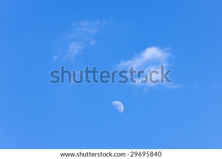 sky landscape - the moon and clouds in sunny day