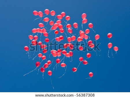 Red balloons in the sky on a holiday