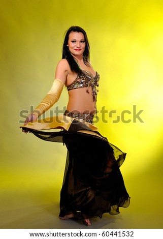 Beautiful dancer woman in bellydance costume with pretty professional stage make-up