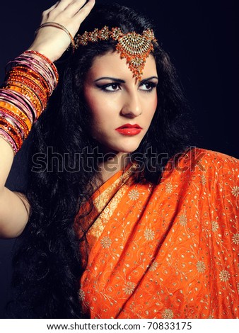 Young beautiful woman in indian traditional sari dress