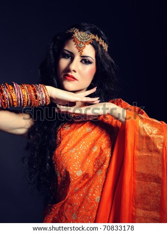 Young beautiful woman in indian traditional sari dress