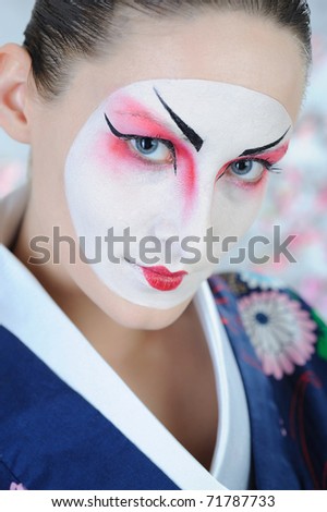 close-up artistic portrait of japan geisha woman with creative make-up