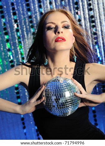 Attractive sexy woman dancing in the disco