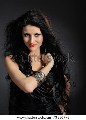 Beautiful woman with long black healthy hair in arabic traditional ...