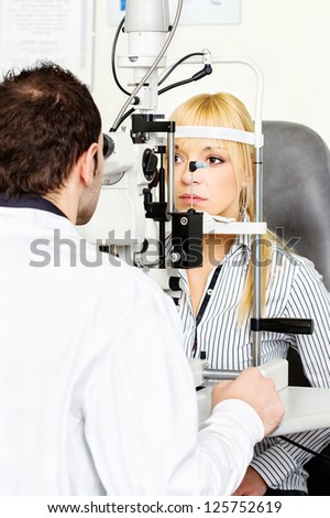 Eye doctor performing an eye examination