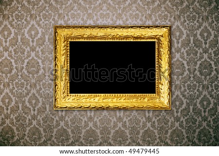 Gold frame over vintage wallpaper
