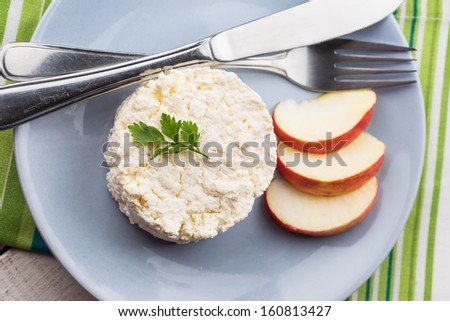 Fresh dairy products - cottage cheese on plate with apple. Rustic style. Bio/organic/natural ingredients. Healthy eating.