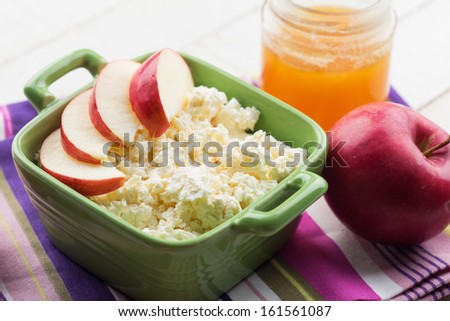 Fresh dairy products - cottage cheese in bowl with apple and honey. Rustic style. Bio/organic/natural ingredients. Healthy eating.