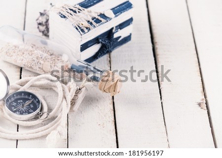 Marine items on wooden background. Sea objects on wooden planks. Selective focus.