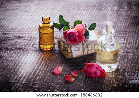 Natural handmade soap and aroma oil on wooden background. Selective focus. Rustic style.