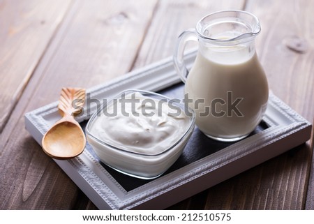 Fresh dairy products - milk, sour cream.  Rustic style. Bio/organic/natural ingredients. Healthy eating.
