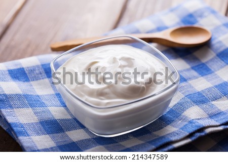 Sour cream in bowl.  Rustic style. Bio/organic/natural ingredients.