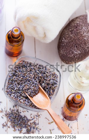 Spa setting with lavender on white painted wooden background. Selective focus.