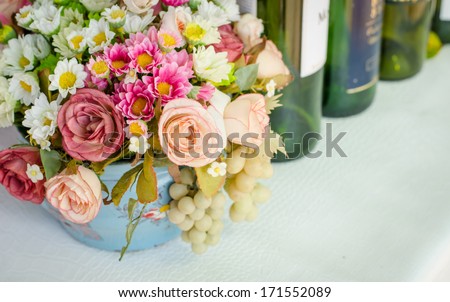 Beautiful flower bouquet and wine bottles,still life