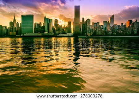 Midtown Manhattan, New York. View from Long Island City. Sunset scene.City lights. Urban living and transportation concept