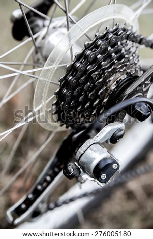 Close up bike chain gear shot on the beach . Outdoors, nautical, biking, urban living, cross fitness and adventure background concept