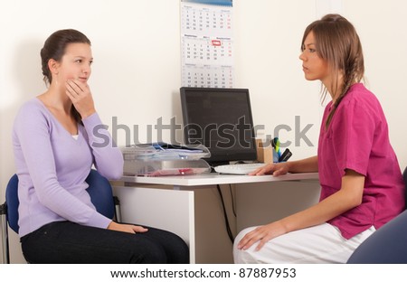 Patient explaining problems to dentist