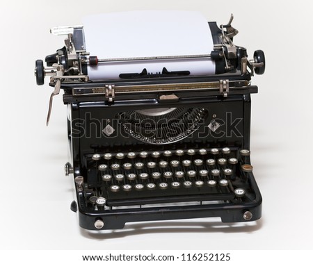 Old type writer with paper sheet