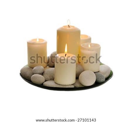 white  burn candles and  pebbles isolated on white
