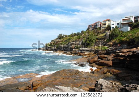 Bondi to Coogee coastal walk, Sydney, Australia. A cliff top coastal walk extends for 6 km in SydneyÃ¢Â?Â?s eastern suburbs. The walk features stunning views, beaches, parks, cliffs, bays and rock pools.