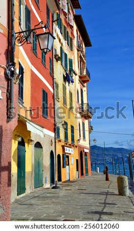 Empty street with colorful buildings in Portofino, an Italian fishing village and upmarket resort famous for its picturesque harbour. Portofino, Liguria, Italy