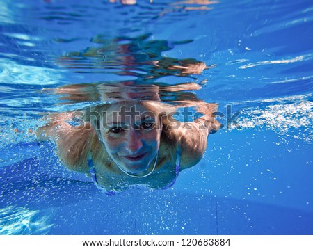 underwater picture of swiming woman