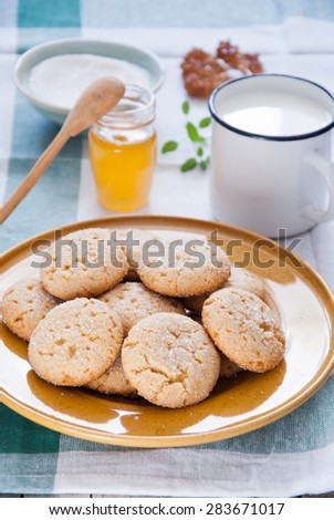Homemade sugar honey cookies on a yellow plate