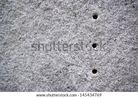 Round hole on the granite.The surface of Black and white granite stone. For texture background