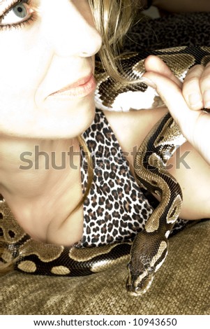 Woman posing with snake.