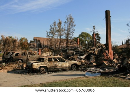 SAN DIEGO, CA - OCTOBER 28: Homes & cars lie in ruins on October 28, 2007 after being destroyed by the \