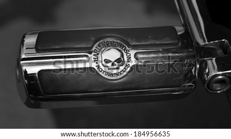 PRETORIA, SOUTH AFRICA - MARCH 29, 2014: Clutch or brake pedal with legendary skull logo on a Harley Davidson motorcycle in black and white.