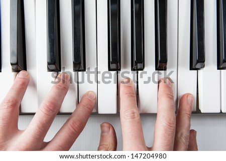 A piano player viewed from above