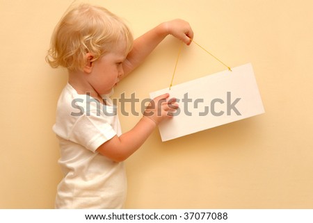 Child holding blank placard