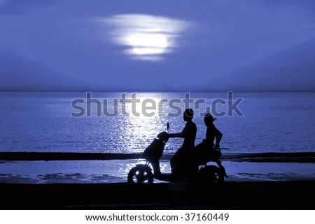 Silhouette two young people go on motor scooter on moon night