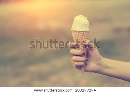 Vintage photo of woman hold ice cream