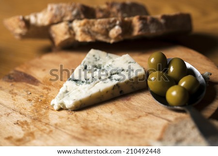 Bread and cheese on wooden table