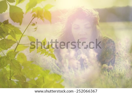 Double exposure of relaxing / meditating woman