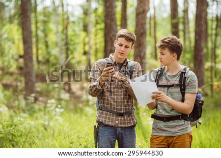 two young tourist determine the route map and navigator