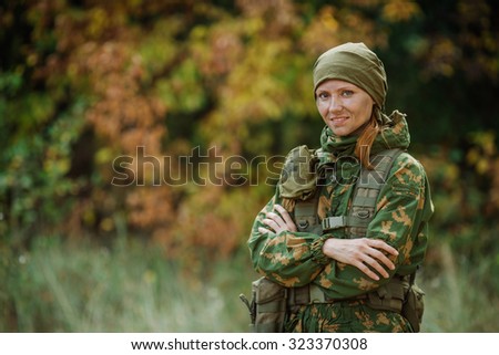Female Russian soldier medic in universal camouflage army uniform and stethoscope