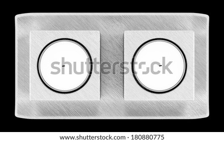 top view of two metallic candlesticks with candles isolated on black background