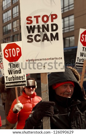 TORONTO - JAN  26 : industrial wind turbines Protesters  marching to Liberal Leadership convention in Toronto  January 26 2013 1 in Toronto, Canada.