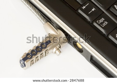 Laptop locked with Security cable lock close-up