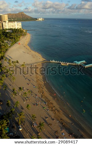 Looking down at Waikiki Beach in Honolulu, Hawaii and across to Diamond Head as the sun sets.