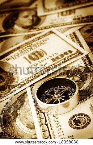 Close up of compass and money