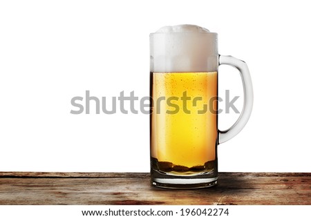 Mug of lager beer on wooden rack isolated on white background