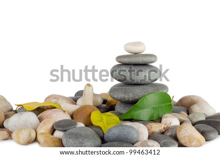 Pyramid of the round sea stones with leaves isolated on white background Foto stock © 