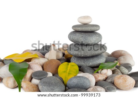 The pyramid of round stones with leaves isolated on white background Foto stock © 