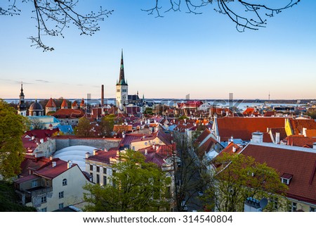 Panoramic view of old town Tallinn, Estonia. Iconic tourist place. Oleviste church, old port and neighboring buildings