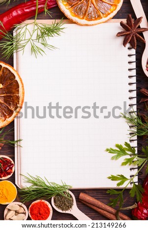 Colorful spices and herbs with paper frame